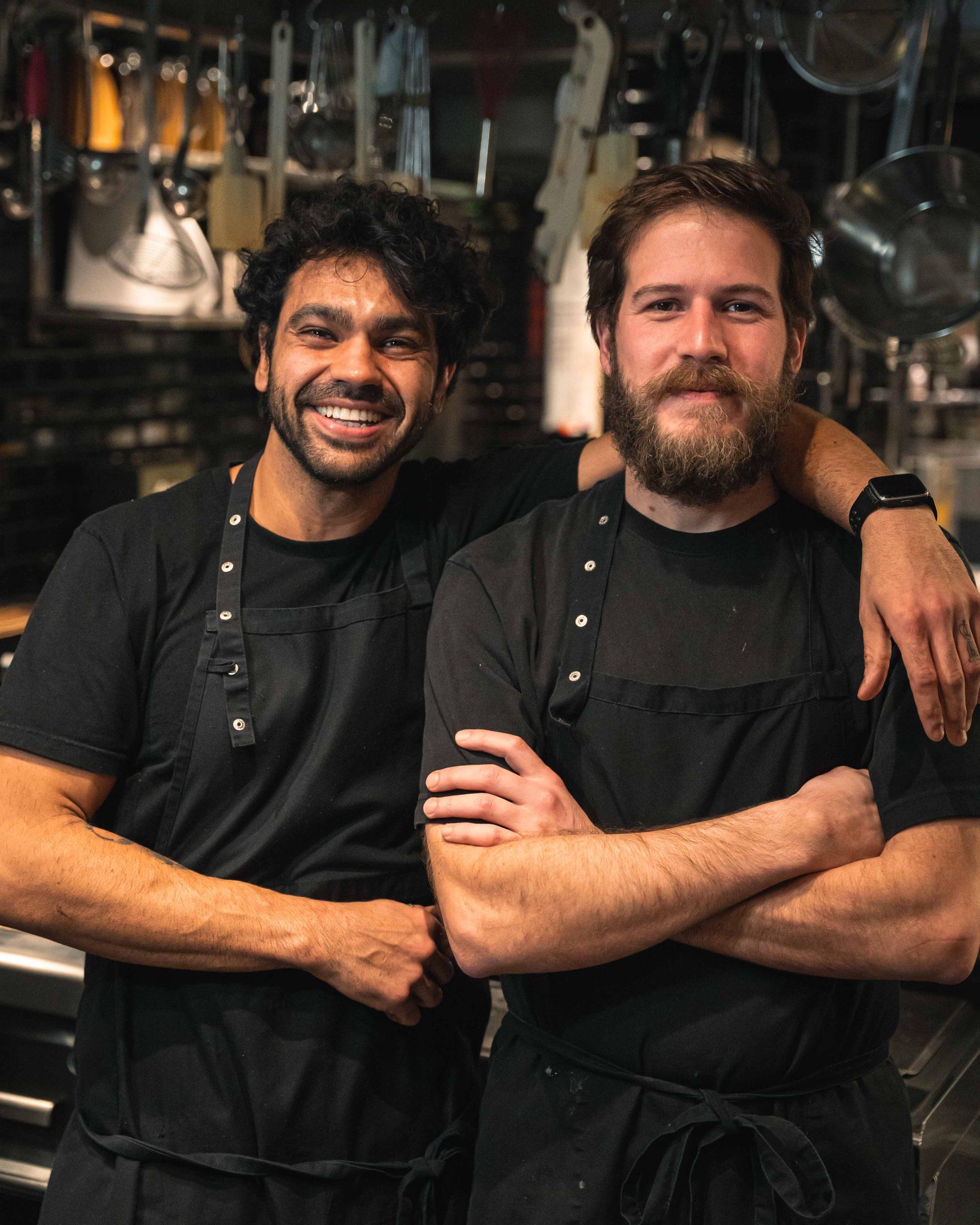 Portrait of the two owners smiling